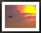 Commercial airplane at sunset