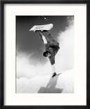 Snowboarder doing a handstand