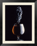Bunch of Grapes Over a Glass of Wine