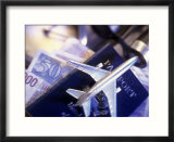 Model jet over US passport and foreign currencies