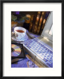 Laptop computer  CD-ROM  cup of tea  and books