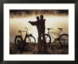 Mature couple dancing near bicycles  CO