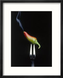 Steaming chili pepper on fork