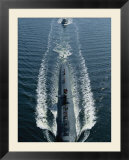 A Los Angeles-class attack submarine cruises into port