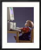 Baby Sitting at Desk Using Computer