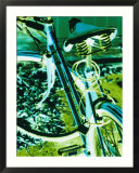 Bright blue and green colors create an electrifying view of a bicycle