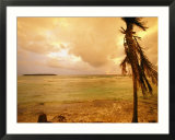 A tropical beach scene with an island in the background