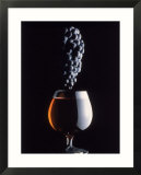 Bunch of Grapes Over a Glass of Wine