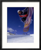 Snowboarder with Colorful Board Doing a Trick