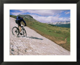 Mountain biking across a patch of snow