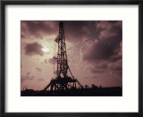 Silhouette of an Oil Rig at Sunset
