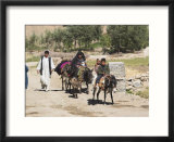 Aimaq People Walking and Riding Donkeys Entering Village  Between Chakhcharan and Jam  Afghanistan