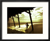 Surfer Walking along Tide