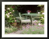 Green Metal Table & Chairs Beneath Arbour