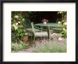 Green Metal Table & Chairs Beneath Arbour