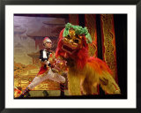 A Man Dressed as Lion Tamer Trains a Lion Played by an Acrobat