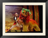 A Man Dressed as Lion Tamer Trains a Lion Played by an Acrobat