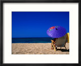 A Girl on the Beach Shading Under a Colourful Umbrella  Waikiki  Oahu  Hawaii  USA