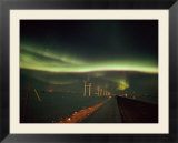 The aurora borealis streaks across the evening sky