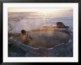 A hiker enjoys a dip in a hot springs in Long Valley
