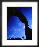 Hiker Silhouetted Beneath Delicate Arch  Arches National Park  Utah  USA