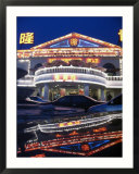 A Karaoke Bar on Dongsanhuan Road is Reflected in a Vehicles Trunk