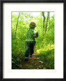 Little Boy with a Jar on a Trail in the Woods