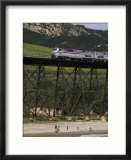 The Coast Starlight Passes over a Trestle Bridge near Santa Barbara  California