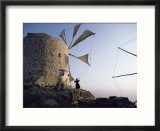 Woman Adjusting Sails of a Windmill  Olimbos  Karpathos  Greece