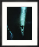 Diver is Silhouetted in a Lead in the Ice of Mcmurdo Sound