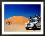 Men on Four Wheel Drive Vehicle at Dune 45 in Namib Nauklaft National Park  Sossusvlei  Namibia