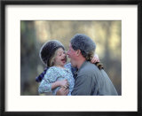 A Father and His Daughter Laugh Together While Wearing Coonskin Hats