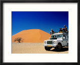 Men on Four Wheel Drive Vehicle at Dune 45 in Namib Nauklaft National Park  Sossusvlei  Namibia