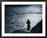 Silhouetted Man Bathing in the Colorado River at Twilight