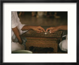 A Thai fortune teller predicts the future for a client