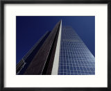 The desert sky reflected in the soaring glass walls of a 40-story building