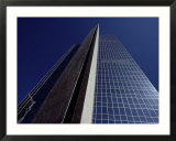 The desert sky reflected in the soaring glass walls of a 40-story building