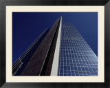 The desert sky reflected in the soaring glass walls of a 40-story building