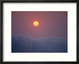 View of rising sun above surf