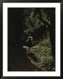 A child plays in a garden in Provence