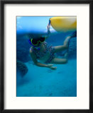 Girl Snorkelling While Holding Onto Canoe  Cook Islands