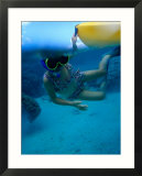Girl Snorkelling While Holding Onto Canoe  Cook Islands