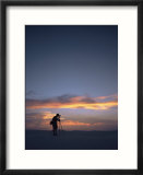A photographer shoots twilit photos in White Sands National Monument