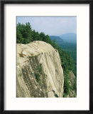 Mountain biker on edge of cliff  Cathedral Rock  North Conway