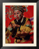 A Chinese Opera Performer in Monkey Makeup and Costume