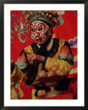 A Chinese Opera Performer in Monkey Makeup and Costume
