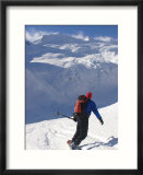 A Back-Country Snowboarder Descends a Snowfield Toward a Glacier