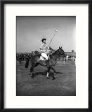 Prince Philips Rides Along on Horseback Holding Polo Stick During Game