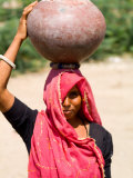 Local Woman Carrying Water Pot on Head  Village of Chakhsu  Jaipur  Rajasthan  India