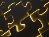 Black Puzzle with Yellow Light Shining Through the Cracks